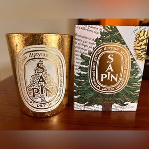 Diptyque empty special edition gold Sapin candle vessel.